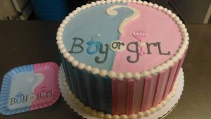 round gender reveal cake half pink half blue