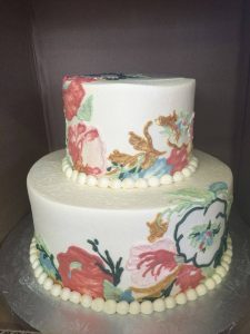 round cake with different flowers on it