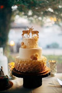 wedding cake with deer and doe topper
