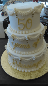 white and gold 50th anniversary cake