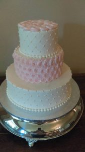 romantic white and pink wedding cake with lattice details