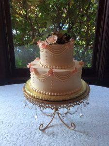 wedding cake with roses and jewelry-like details