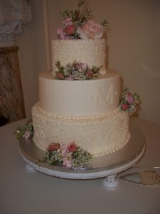 delicate wedding cake with roses