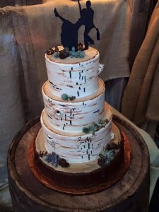 Birch tree wedding cake with shilouete bride and groom topper