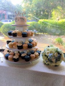 cup cake stand with wedding cake and monogram topper