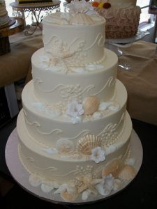 all white beach themed wedding cake