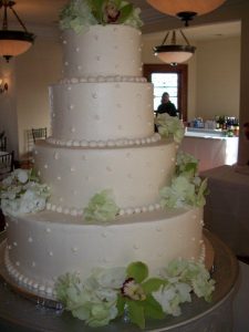 four tier wedding cake with pale lime flowers