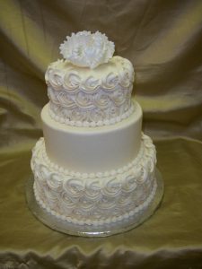 three tier white wedding cake